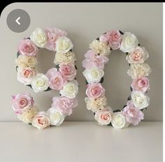 the word do spelled with flowers on a shelf