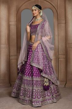 Purple attached cancan panelled lehenga with zari thread, sequin embroidery in floral pattern. Paired with half sleeve padded blouse and dupatta.
Components: 3
Pattern: Embroidery
Type Of Work: Zari thread, sequin, floral
Neckline: U neck
Sleeve Type: Half
Fabric: Raw Silk
Color: Purple
Other Details: 
Lehenga Length: Approx 45-46 inches
Panelled lehenga
Side and back tassel tie-up
Sheer embroidered dupatta
Occasion: Bride - Aza Fashions Panelled Lehenga, Scoop Neckline Blouse, Lehenga Sarees, Embellished Lehenga, Raw Silk Embroidery, Sari Lehenga, Purple Lehenga, Orange Lehenga, Beautiful Lehenga