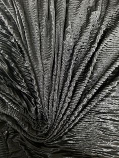 an up close shot of the fabric in black and silver tones, with very thin folds