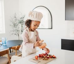 Calling all mini cooks! Our kids apron + hat set is a true kitchen essential for any mini chef. Bring on the splatters, spills, and splashes! Ties at neck and waist, and has a large front pocket for easy-access storage. Made from a lovely mix of organic cotton and linen. ⋒ Organic 55% linen + 45% cotton ⋒ Machine washable DIMENSIONS: ⋒ Width of apron 21 1/2 in. Length 22 in ⋒ Circumference of chef's hat 19 3/4 in CARE: Machine wash cold in delicate cycle Lay flat to dry Low iron if necessary Do not bleach Kid Chef, Mini Chef, Toddler Apron, Healthy Brain, Baking Set, Toddler Age, Chef Apron, Chefs Hat, Kids Apron