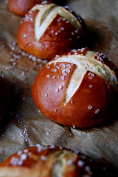 some bread rolls with white sprinkles on them