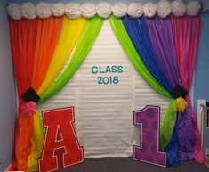 a classroom door decorated with colorful curtains and letters that spell out the word class 2018