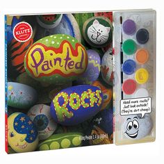 an assortment of painted rocks in a box