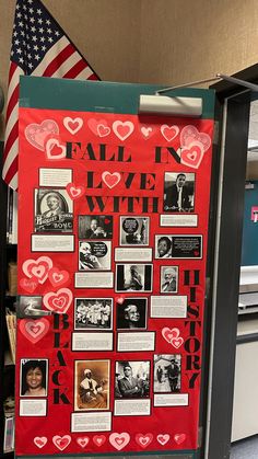 a red bulletin board with pictures and hearts on it in an office cubicle area