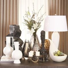 vases, lamps and other decorative items on a table