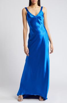 Elevate your next event look in this gorgeous satin gown designed with a sleek V-neckline, cross-back straps and a draped, body-defining silhouette. 59" length; 9" train (size Medium) Hidden back-zip closure V-neck Sleeveless Partially lined 97% polyester, 3% spandex Hand wash, line dry Imported Satin Gown Designs, Liquid Satin, Royal Blue Dress, Satin Gown, Lingerie Romper, Designer Clothes For Men, Girly Outfits, Event Dresses, Wedding Attire