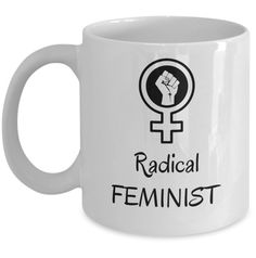 a white coffee mug with the words radical feminist in black on it and a fist