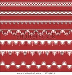 a red and white pattern with fringes