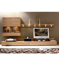 a living room with a tv and some shelves on the wall next to a checkered rug