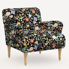 an upholstered floral chair with wooden legs