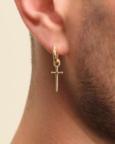 Be bold and defiant in our men's gold Dagger Cross Earring. This single earring features classic gold hoop with a daring dagger charm for playful, eye-catching movement. As always, our earrings are crafted with a 925 silver post for sensitive skin. Collect two to make it a set! Gold Earring For Men, Mens Gold Hoop Earrings, Cross Earring, Gold Earrings For Men, Dagger Earrings, Solid Gold Chains, Cross Earrings, Silver Shop, Mens Gold