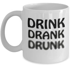 a white coffee mug with the words drink drank and black letters on it's side