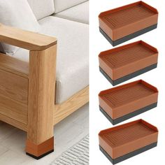 four brown trays sitting on top of a wooden table next to a white couch