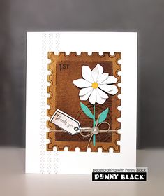 a card with a white flower on it