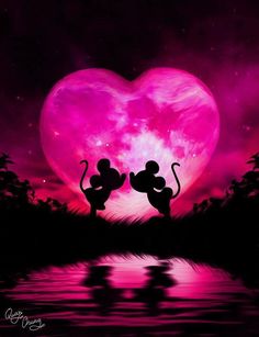 two mickey and minnie mouse silhouettes in front of a heart shaped pink sky with the moon