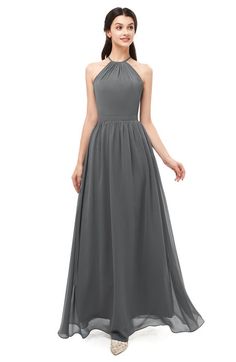 a woman wearing a long gray bridesmaid dress with halt neckline and pleaed skirt