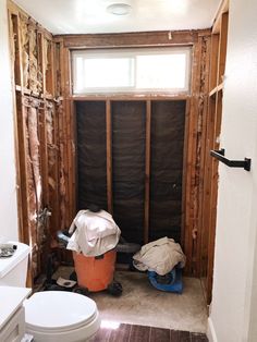 a bathroom that is under construction with the walls torn off