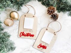 two wooden christmas tags with the words, sleep until christmas and santa clause on them