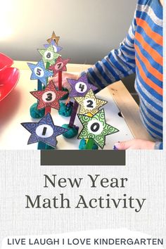 a young boy is making a new year math activity with colorful paper stars and numbers