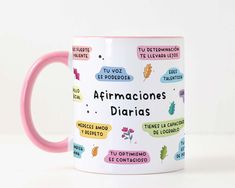 a pink and white coffee mug with the words affirmacones diarias on it