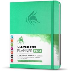 a green planner book with the title clever fox planner pro on it's cover