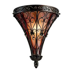 a light fixture with an intricate design on the front and back sides, against a white background