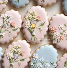 decorated cookies with flowers and leaves on them