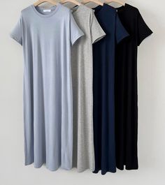 The Comfy Tee Dress offers the ultimate in casual comfort and effortless style. Featuring a relaxed fit and made from soft, breathable fabric, this dress is perfect for everyday wear. The simple design includes short sleeves and a classic round neckline, making it easy to dress up or down. Available in versatile colors like grey, black, and navy, it's ideal for pairing with sandals or sneakers for a laid-back look. Color : Heather Grey / Black / Lt. Blue / Navy Size : One Size (Fits X-small to Medium) Chest : 19" / Length (HPS) : 47" Model : 5’4″ (164cm) wearing one size Content : 95% Rayon / 5% Span Care Instructions : Gentle Cycle Machine Wash Cold With Like Colors *** Please note this item ships out in approx. 5~10 days after order placement *** Casual Solid Color T-shirt Dress For Loungewear, Modest Short Sleeve Solid Color Dress, Casual Cotton Short Sleeve Dress With Relaxed Fit, Cotton T-shirt Dress For Everyday, Casual Cotton Short Sleeve Midi Dress, Casual Cotton Midi Length Short Sleeve Dress, Casual Short Sleeve Cotton Midi Dress, Casual Solid Color Knee-length Short Sleeve Dress, Spring Short Sleeve T-shirt Dress In [color]