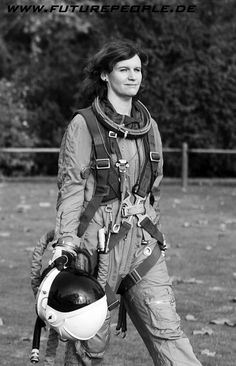 black and white photograph of a woman in flight gear