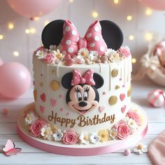 a birthday cake decorated with minnie mouse ears