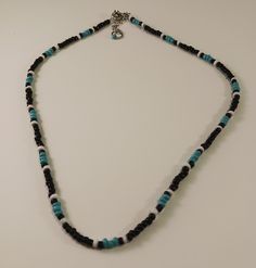 This is a Southwest style seed bead necklace.  The necklace is 17 inches long with a 2-inch extension chain.  The bead colors are black, turquoise and white. Turquoise And Black Beads Necklace For Jewelry Making, Black Beaded Heishi Beads Necklace, Turquoise Beaded Necklaces With Black Beads As Gift, Gift Turquoise Beaded Necklaces With Black Beads, Adjustable Black Beaded Turquoise Necklace, White Seed Bead Necklace, Black Turquoise, Southwest Style, Seed Bead Necklace