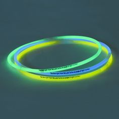 two glow bracelets sitting next to each other