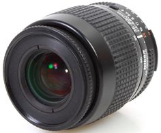 a close up of a camera lens on a white surface