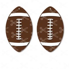 two footballs with crossed bats on them, one is brown and the other is white