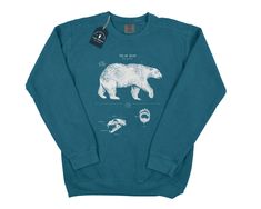 Wildlife anatomical designs screen printed onto quality stitched cotton/poly sweatshirts. These sweatshirts are designed to spark conversation. Each shirt is twined and tagged giving a classic nautical presentation. Makes a perfect & thoughtful gift for any animal lover in your life. Sweatshirt stats: * 80% ringspun cotton & 20% polyester * Soft washed garment dyed fabric * 1x1 rib on collar, cuffs, and waistband * Double-needle collar * Twill taped back neck * Rolled-forward shoulder * Bear Print Crew Neck Sweatshirt For Streetwear, Crew Neck Sweatshirt With Bear Print For Streetwear, Streetwear Crew Neck Sweatshirt With Bear Print, Crew Neck Bear Print Sweatshirt For Streetwear, Bear Design Crew Neck Tops For Streetwear, Bear Anatomy, Marine Biology Shirts, Biology Gifts, Shark Sweatshirt