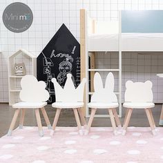 three children's chairs in front of a bunk bed