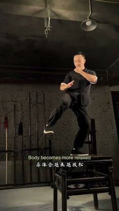 a man is doing tricks on a skateboard in an empty room with words above him