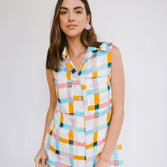 A fan favorite cover-up is back in an updated rainbow print! The Bay dress is made with a soft, lightweight organic cotton. Wear it unbuttoned over a swimsuit for a day at the beach, throw on some jean shorts for a laid back look or wear it buttoned up with sneakers for a casual lunch. Size Guide: To help with sizing, please refer to our guide below. SM: 0-4 M: 6-8 L: 10-12 Model is 5'10", size 2-4 and wearing a size small Details: 100% Cotton Made in India Beachy Upf 50+ Tops For Spring, Casual Summer Top With Upf 50+, Cotton Tops With Upf 50+ For Summer, Spring Cotton Tops For Poolside, Cotton Tops For Poolside Spring Festivals, Cotton Tops For Spring Poolside, Casual Summer Tops With Rainbow Print, Casual Rainbow Print Summer Tops, Playful Cotton Beach Tops