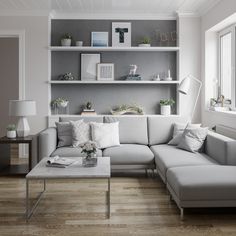 a living room filled with lots of furniture and decor on top of a hard wood floor