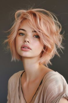 Rose gold hair is a stunning choice for those looking to add a touch of whimsy and warmth to their look. Perfect for any season, these styles promise to illuminate your features and refresh your aesthetic. Alt Glam, Rose Gold Short Hair, Coral Hair Color, Cherry Blonde, Gorgeous Haircuts, Blond Rose, Pink Short Hair, Peach Hair Colors, Grey Bob Hairstyles