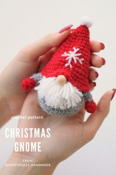 a crocheted christmas gnome is in someone's hand