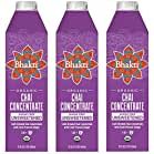 three bottles of organic chai concentrate are shown in this image, one is purple and the other is red