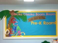 a child's room with a bulletin board on the wall that says chicka chicka boom boomboom