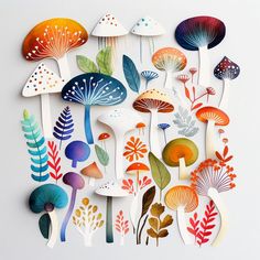 an assortment of colorful mushrooms and plants cut out of paper