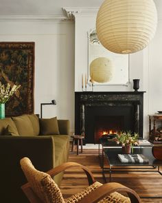 a living room filled with furniture and a fire place