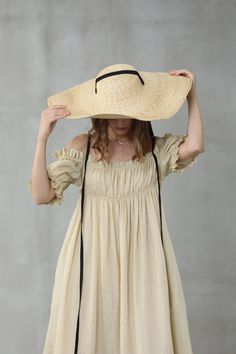 "This linen dress is full of contradictions, ensuring an eye-catching finish. The classic flared structure is contrasted by a slip design, whilst the ruffled details are given a contemporary twist with their asymmetric placement. In an old lace and olive green hue, this flared gown is here to turn heads at every event it attends. Off you go. 【Fabric】 95% linen, 5% silk it is Italian linen. exquisite high end texture. we add 5% silk to make it soft and exquisite. lightweight but a little sheer. l Linen Layers, Cottagecore Dress, Perfect Coat, Linen Midi Dress, Wedding Linens, Apron Dress, Linen Maxi Dress, Wool Skirts, Linen Dresses