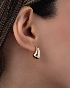 A smaller version of a popular stud, these 14K Gold Medium Teardrop Stud Earrings add a touch of luxury to any ear stack. From a strapless gown to a classic white tee, these earrings elevate your style with their curvaceous, mini bubbly design. Effortless and feminine, they are a trendy must-have for the fashion-forward woman. Size: Approx. 7.8mm(W) x 17.3mm(H) Total Weight: Approx. 2.2 grams (per pair) Standard Production: 2-5 business days Rush Order Production: 1-3 business days Shipping: Sel Elegant Teardrop Hoop Earrings With Polished Finish, Elegant 14k Gold Earrings With Timeless Design, Classic Pear-shaped Polished Earrings, Elegant Polished Teardrop Huggie Earrings, Formal Teardrop Huggie Earrings With Polished Finish, Elegant Teardrop Huggie Earrings With Polished Finish, Elegant Pierced Huggie Earrings For Anniversary, Timeless Teardrop Hoop Earrings For Formal Occasions, Classic 14k Gold Earrings With Timeless Design