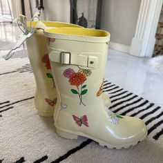 Never Worn Disney Rain Boots. Yellow With Flower Motif. Spring Rain Boots With Round Toe, Spring Round Toe Rain Boots, Yellow Round Toe Rain Boots For Spring, White Round Toe Rain Boots For Spring, Casual Spring Rain Boots With Round Toe, Casual Round Toe Rain Boots For Spring, Casual Yellow Rain Boots For Spring, Spring Fun Boots With Round Toe, Fun Spring Boots With Round Toe