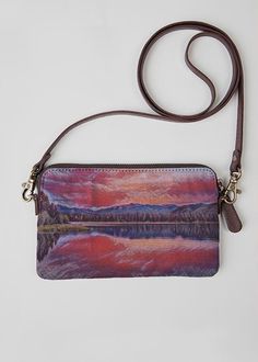 Mountain Lake Watercolor. Crafted from genuine leather and printed canvas, the VIDA Statement Clutch is a versatile standout accessory for any occasion. Audacity Press original. Lake Watercolor, Statement Clutch, Mountain Lake, Printed Canvas, Genuine Leather, Lake, Canvas, Water, Leather