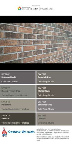 the color scheme for this brick wall is gray and brown, with white lettering on it